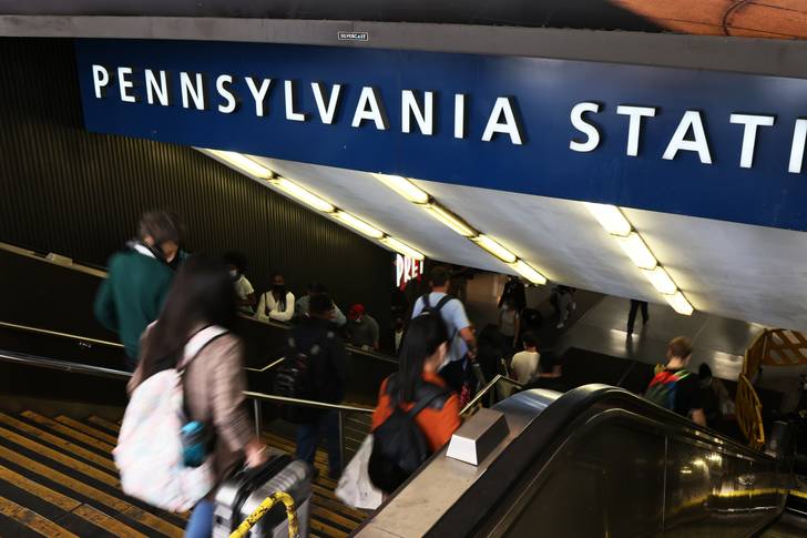 People enter Penn Station in Manhattan.